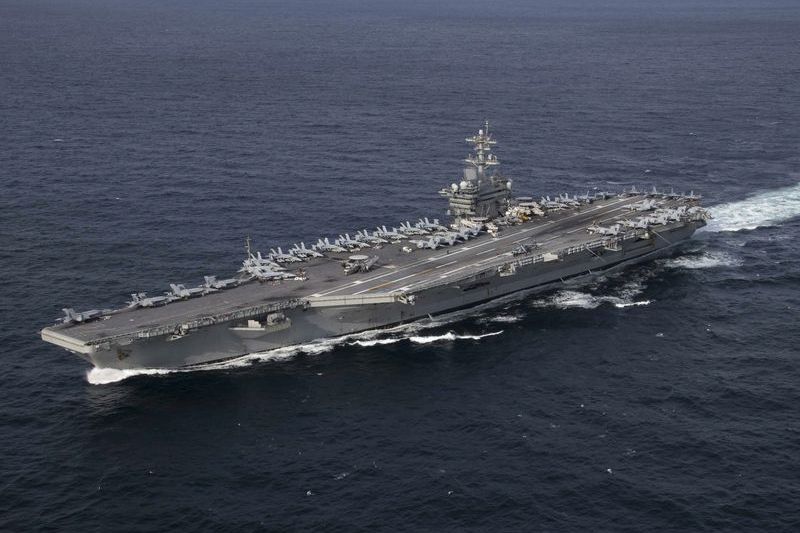 USS Abraham Lincoln (CVN-72) aircraft carrier underway at sea, viewed from above
