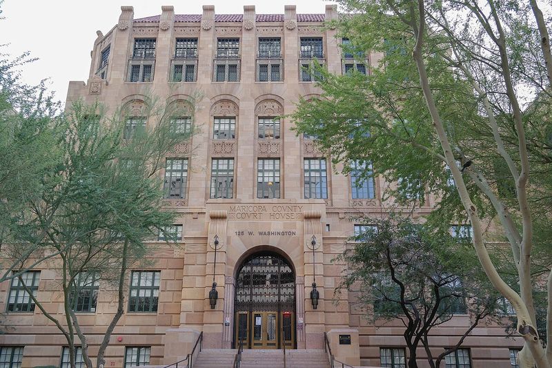 The Maricopa County Court House in Phoenix, Arizona, a multi-story sandstone building with ornate Art Deco facade and arched entrance at 125 W. Washington Street
