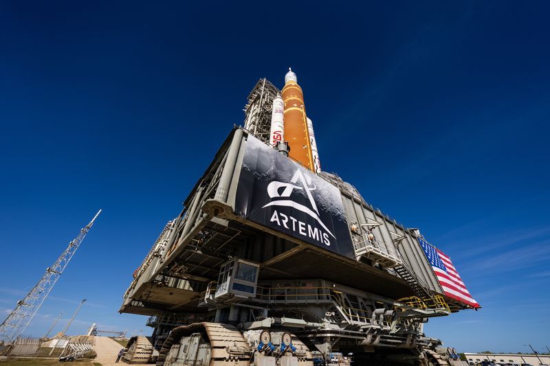 NASA's SLS rocket and Orion spacecraft for Artemis II on the mobile launcher during rollout to Launch Pad 39B at Kennedy Space Center