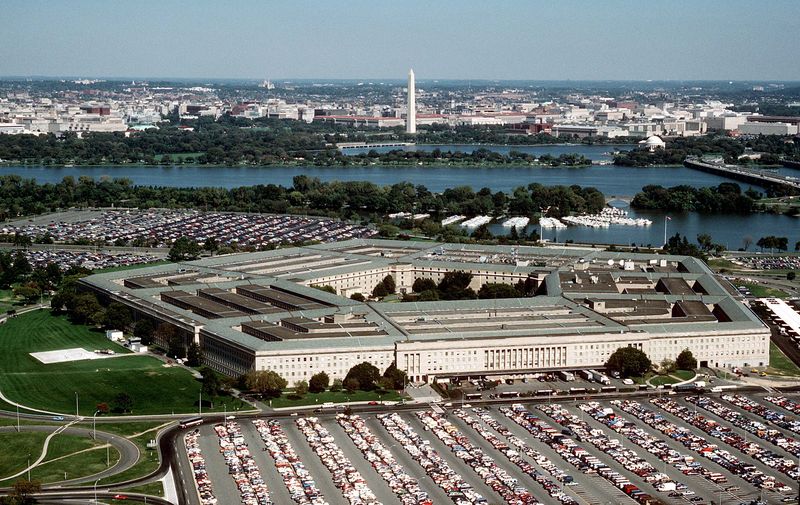 Aerial view of the Pentagon building looking northeast, with the Potomac River and Washington Monument visible in the background