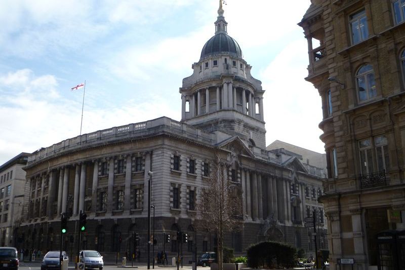 The Old Bailey, London's Central Criminal Court, viewed from street level showing its distinctive domed tower topped with the golden Lady Justice statue