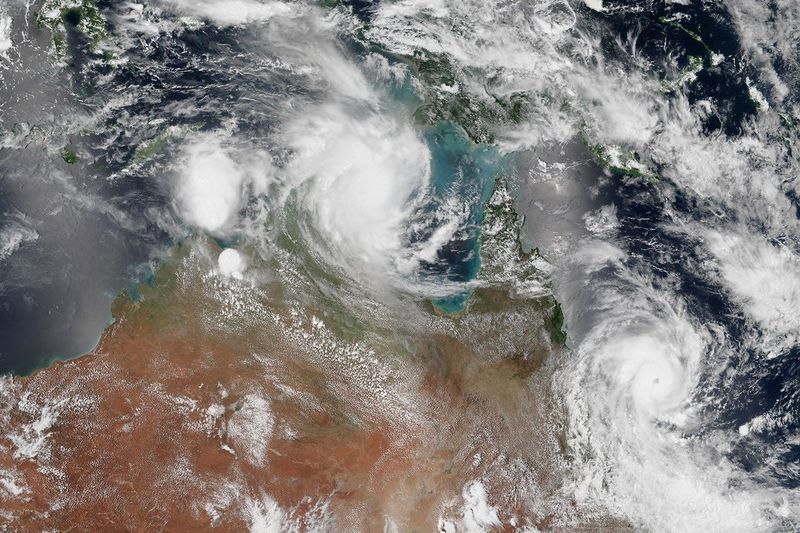 Satellite view of two tropical cyclones approaching northern Australia and Queensland, captured by NASA's Suomi NPP satellite