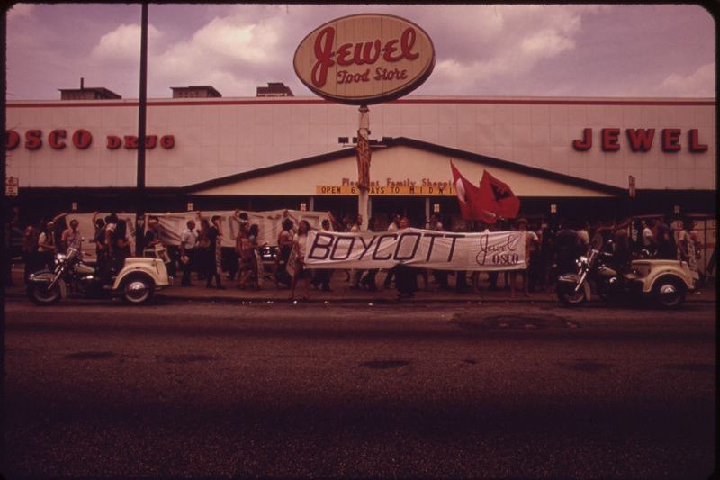 United Farm Workers supporters picketing a Jewel Food Store with a large boycott banner during the 1970s grape and lettuce boycott