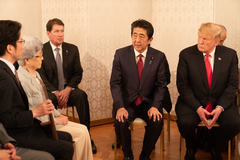 President Donald Trump meets with Japanese officials during a diplomatic visit to Tokyo