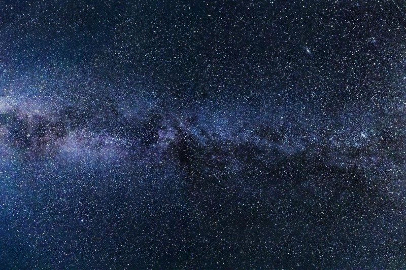 Breathtaking view of Alpe di Siusi in Italy, featuring lush green fields and towering Dolomites under a vivid sky.