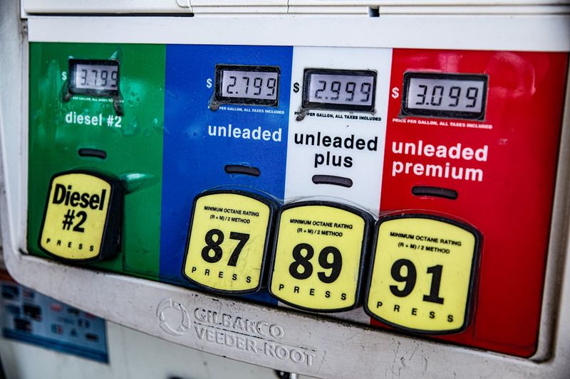 Close-up of a gas pump display showing fuel prices and octane ratings for diesel, unleaded, unleaded plus, and unleaded premium