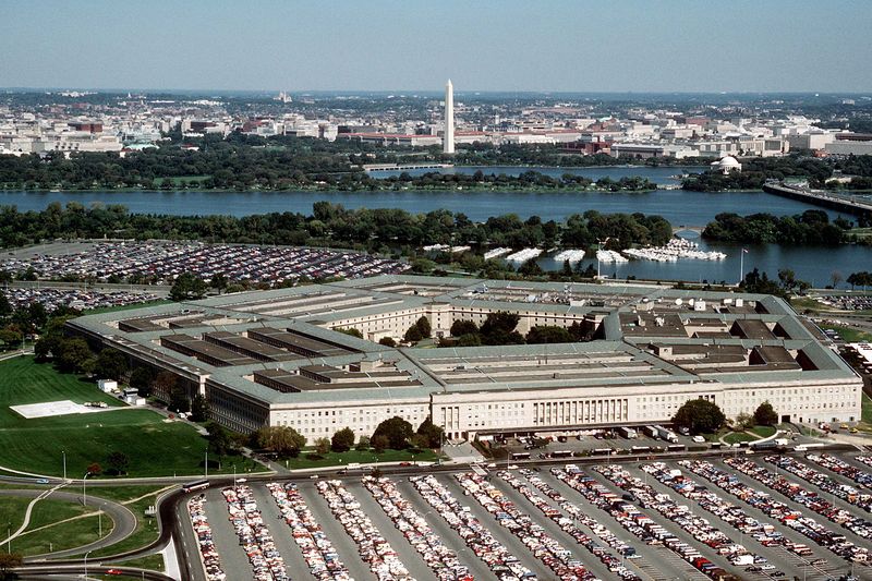 Aerial view of the Pentagon building looking northeast, with the Potomac River and Washington Monument visible in the background