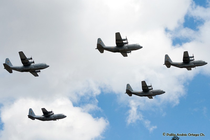Colombian Air Force C-130 Hercules aircraft flying in formation