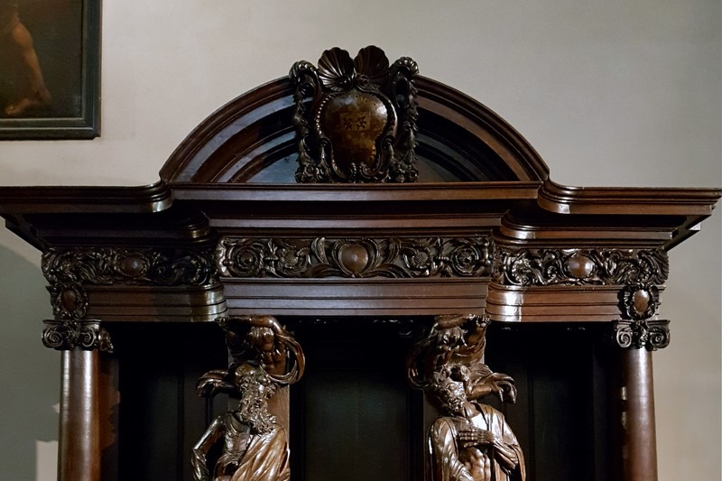 Ornate Baroque confessional with carved wooden figures in the Basilica of Saint-Servatius, Maastricht, Netherlands