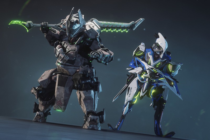Two Warframe characters in futuristic armor holding glowing weapons against dark background