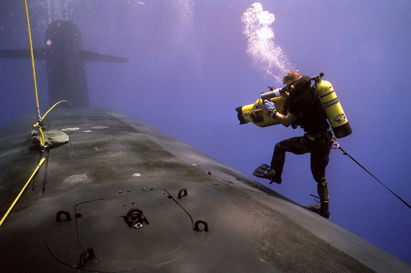A Navy diver documents a nuclear submarine underwater