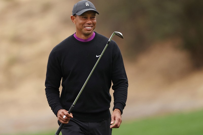 Tiger Woods holding a golf club on a golf course during the 2020 PNC Championship