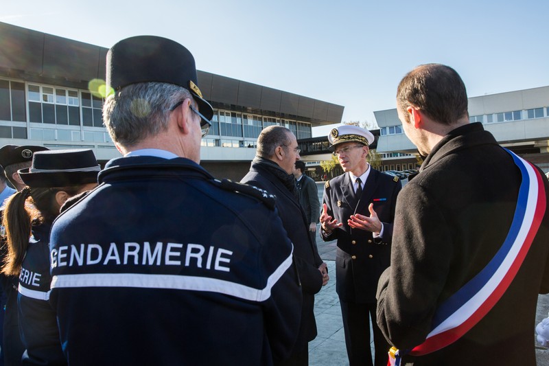 French Gendarmerie and security officials at a formal outdoor gathering outside an institutional building