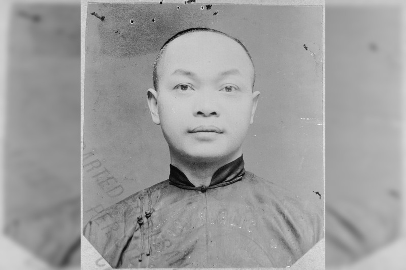 Historical portrait photograph of Wong Kim Ark, a Chinese-American man in traditional Qing-era attire with a queue hairstyle