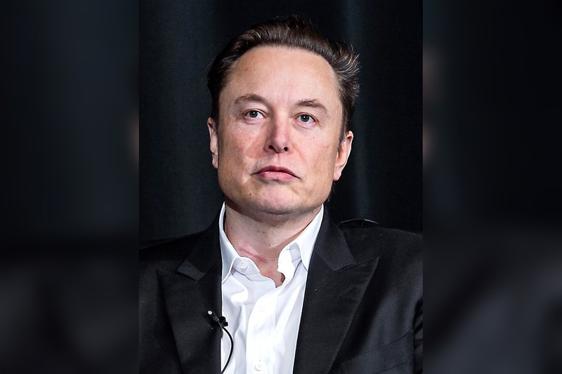 Portrait of Elon Musk against a dark background
