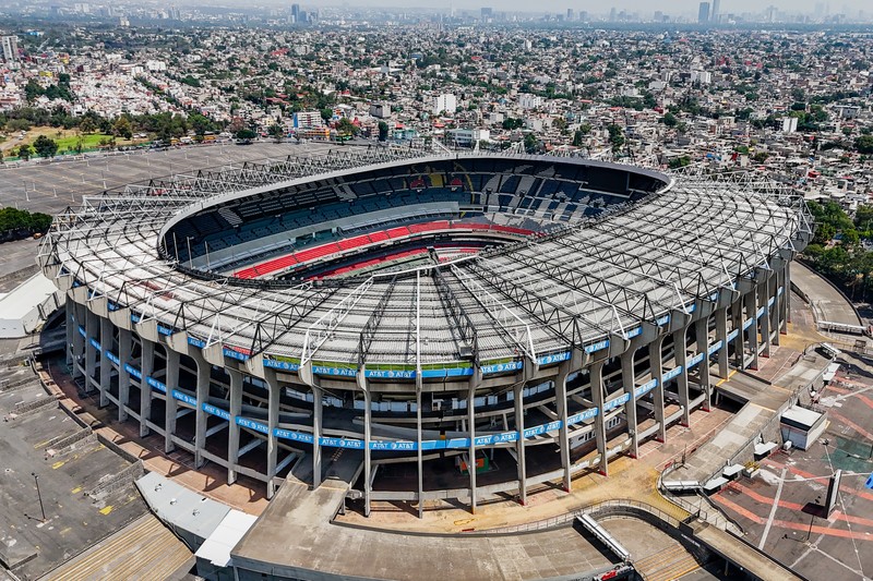 Aerial drone view of Estadio Azteca in Mexico City showing the stadium and surrounding urban landscape
