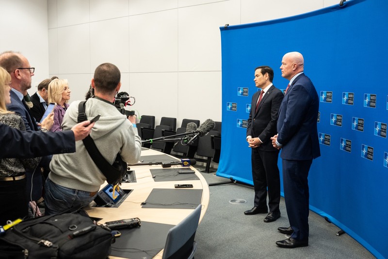 Secretary of State Marco Rubio speaks at a press availability in front of a NATO backdrop at NATO headquarters in Brussels