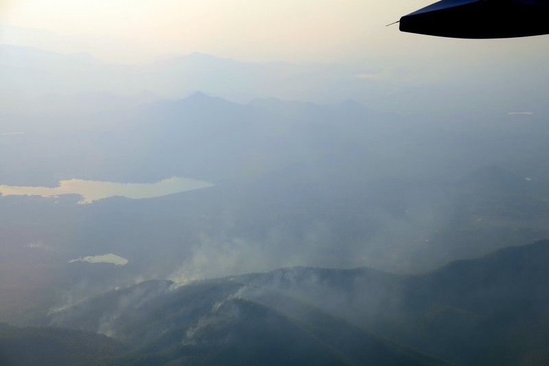 Smoke from wildfires rising over the mountains of northern Thailand during burning season