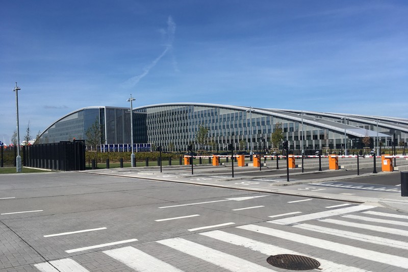 NATO Headquarters building in Brussels with its distinctive curved glass and steel facade