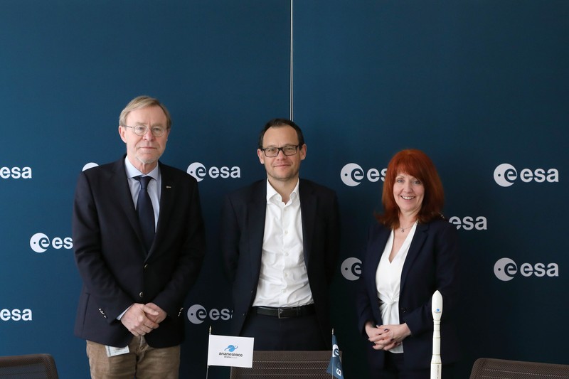 Three officials stand at an ESA-branded event for the Smile mission contract signing