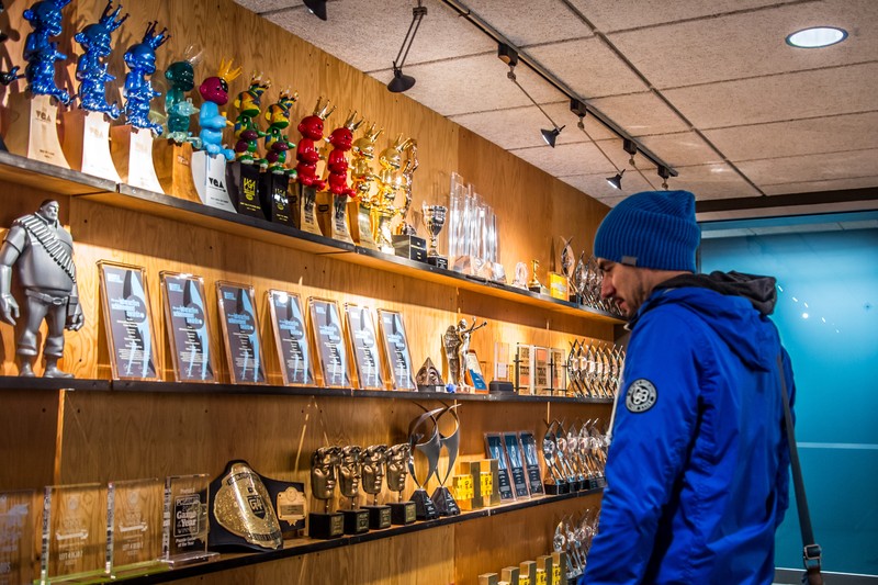 A wall of gaming trophies and awards on display inside Valve Corporation's office