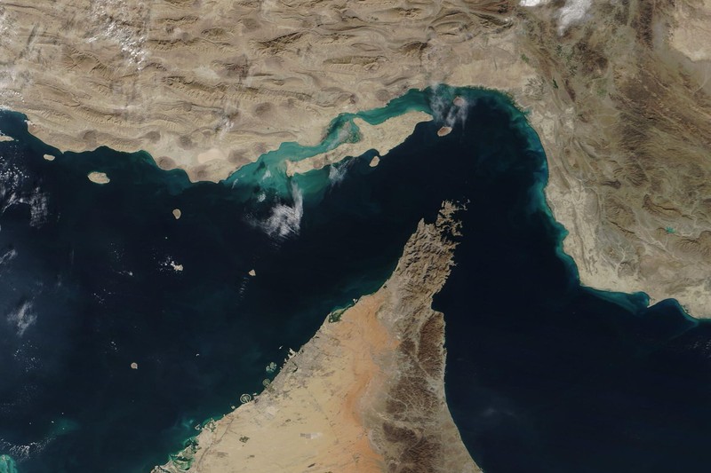 NASA satellite image showing the Strait of Hormuz between the Persian Gulf and Gulf of Oman, with Iran to the north and the Arabian Peninsula to the south