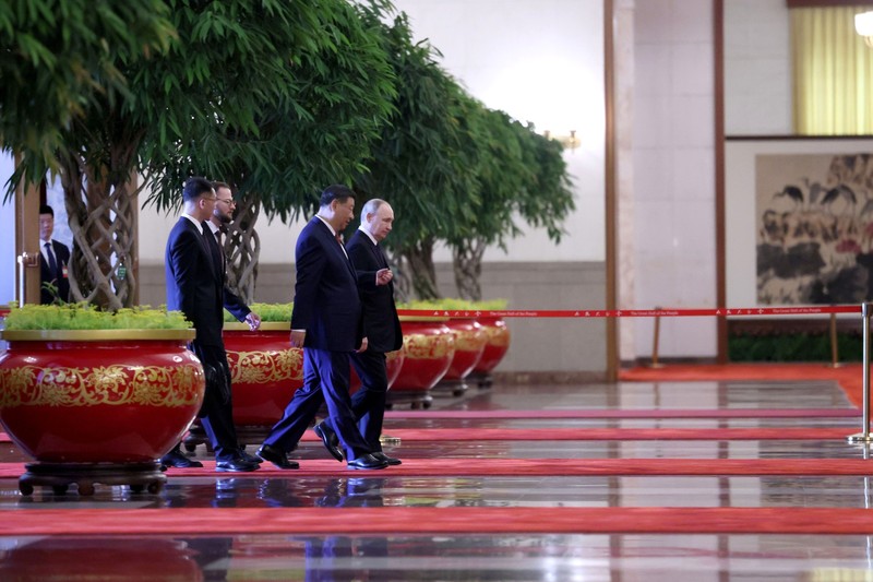 Xi Jinping walks through the Great Hall of the People in Beijing during a diplomatic meeting