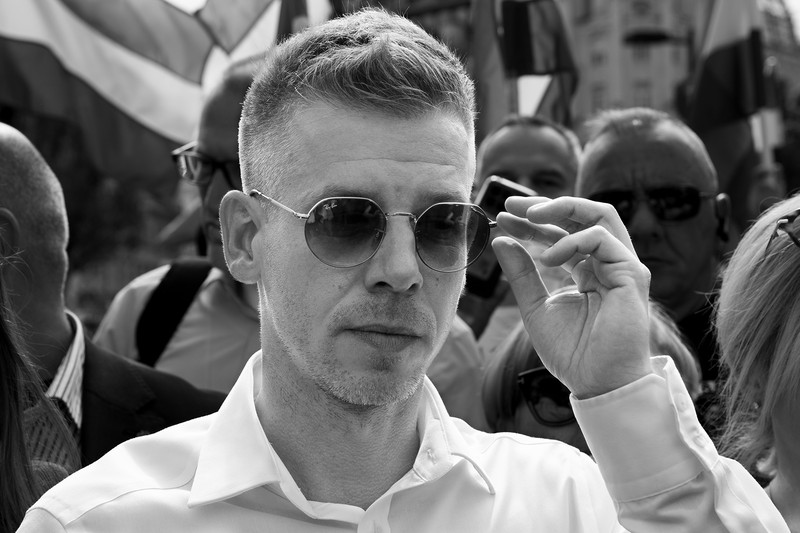 Péter Magyar at a public political rally, surrounded by supporters