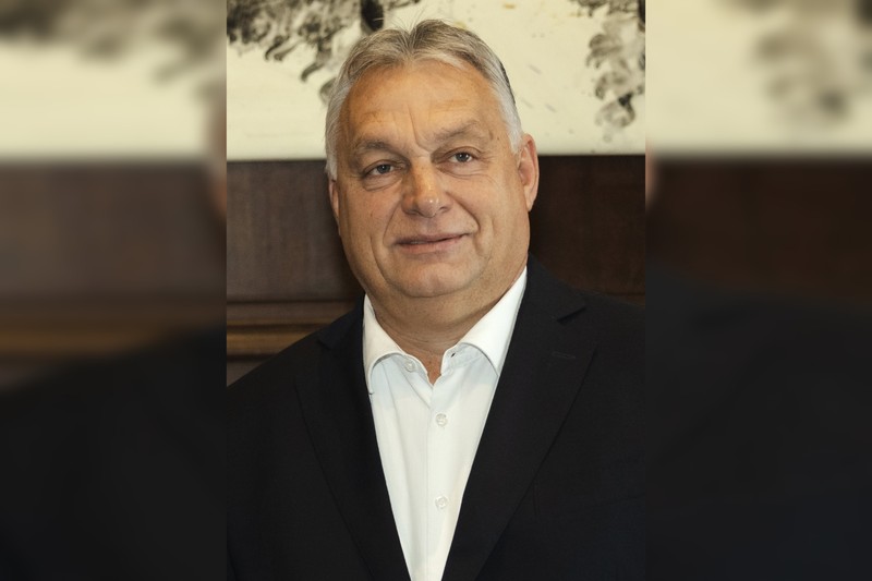 Viktor Orbán in a formal portrait, dressed in a dark suit with a neutral expression
