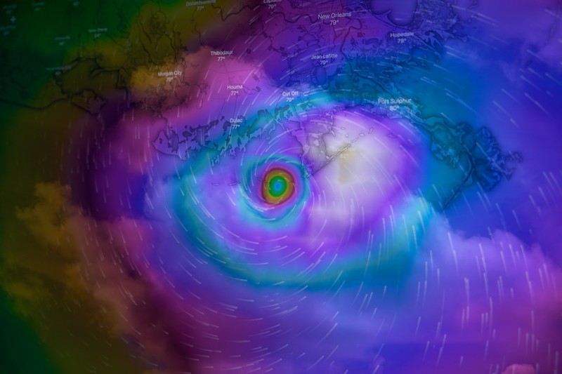 False-color satellite image of a major hurricane showing a well-defined eye and swirling cloud bands