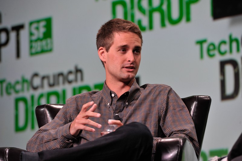 Evan Spiegel speaking on stage at TechCrunch Disrupt SF