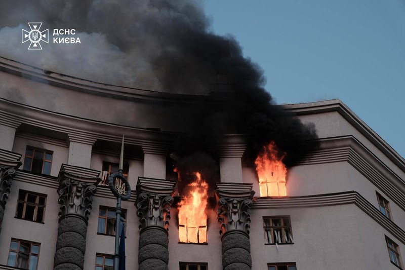 A neoclassical government building in Kyiv burns with flames and thick black smoke pouring from upper-floor windows following a Russian nighttime attack