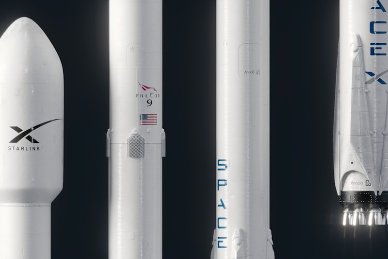 SpaceX Falcon 9 rocket components including a Starlink payload fairing displayed vertically