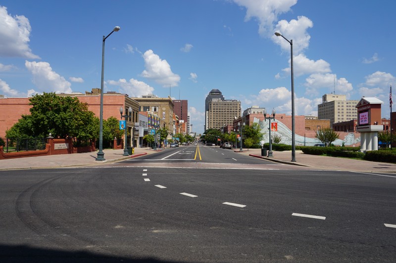 Texas Street in downtown Shreveport, Louisiana, on a clear day with buildings lining both sides of the road.