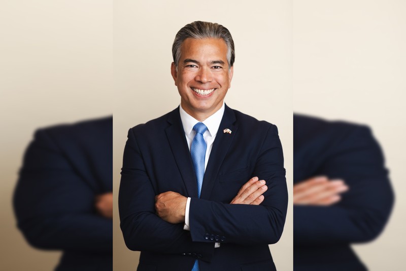 Official portrait of California Attorney General Rob Bonta in a navy suit and light blue tie