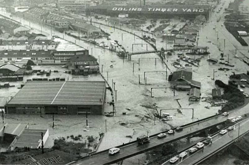 Aerial view of flooding in the Petone industrial area near Wellington, with submerged roads, railway lines, and buildings