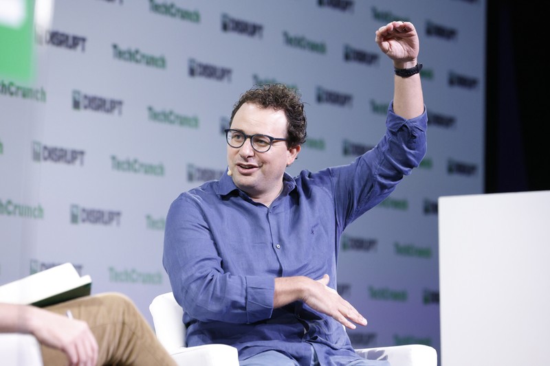 Dario Amodei speaks on stage at TechCrunch Disrupt 2023
