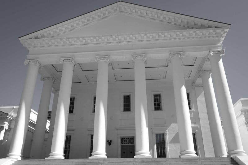 The Virginia State Capitol building in Richmond, viewed from the front with its iconic neoclassical portico and columns