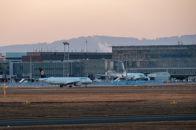 Lufthansa aircraft parked at Frankfurt Airport at dawn