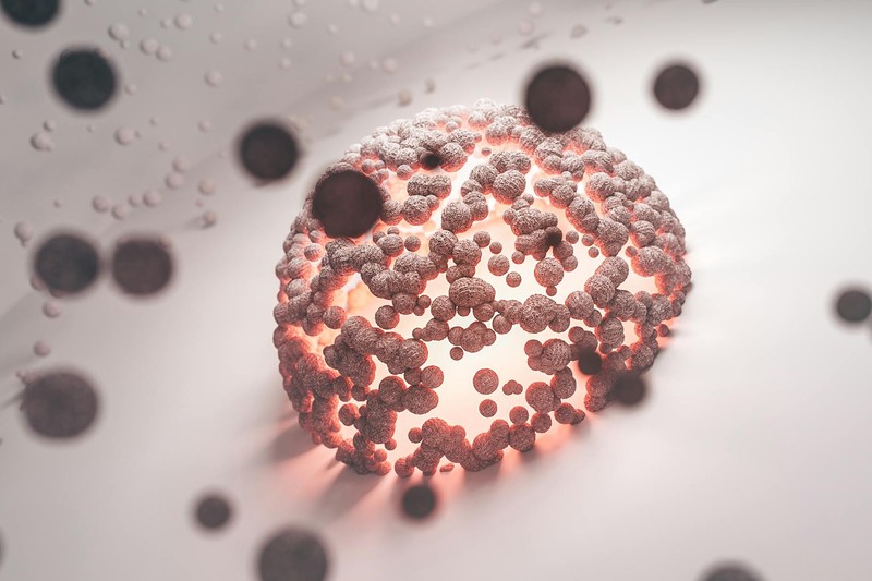 Abstract glowing spherical cell structure representing molecular targeting in cancer research