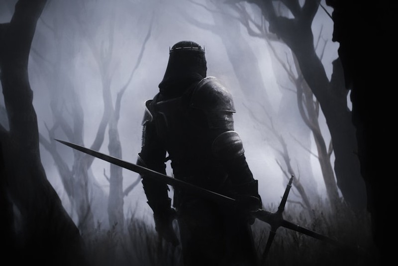 A hooded armored figure holding a sword stands in a dark, misty forest