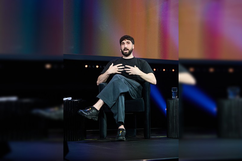 Aidan Gomez, CEO of Cohere, speaks on a panel at the ALL IN conference in Montreal