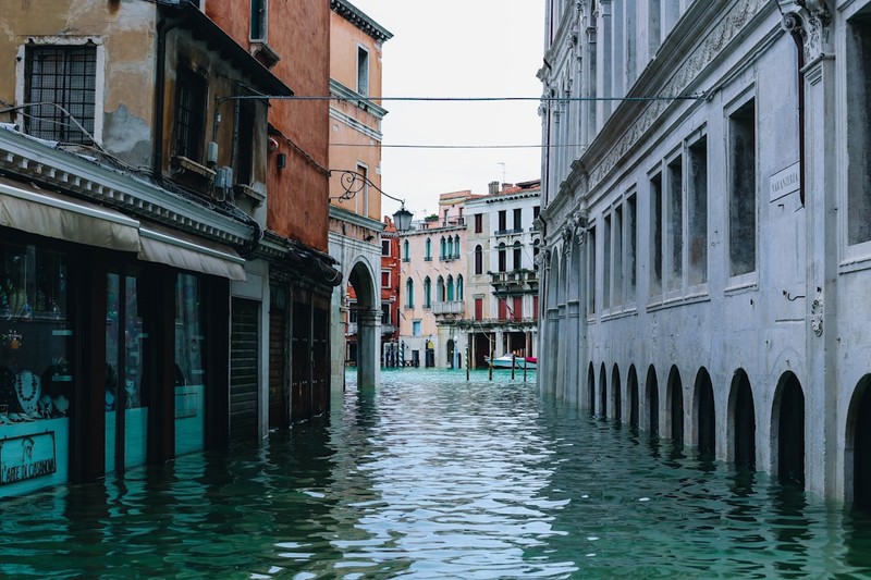 Flooded street in Venice with water covering the ground level of historic buildings