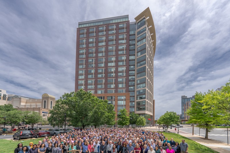 Hundreds of National Science Foundation staff members gathered on the lawn outside NSF headquarters for a group photo commemorating the agency's 75th anniversary.