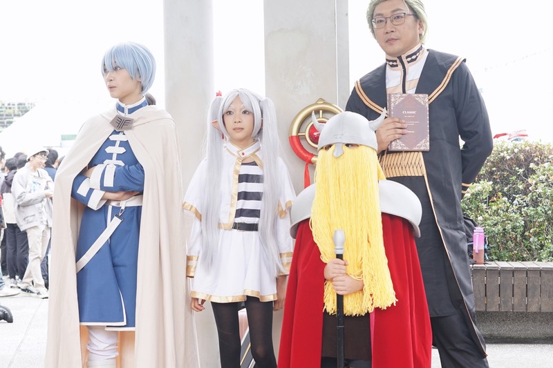 Four cosplayers dressed as characters from Frieren: Beyond Journey's End at an anime convention