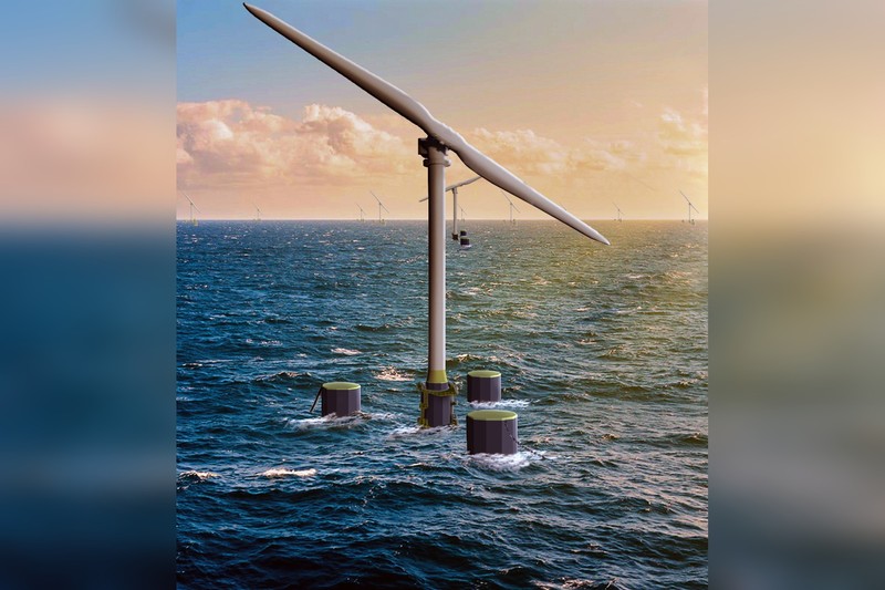 An offshore wind turbine rising from the ocean against a golden sunset sky, with distant turbines visible on the horizon.