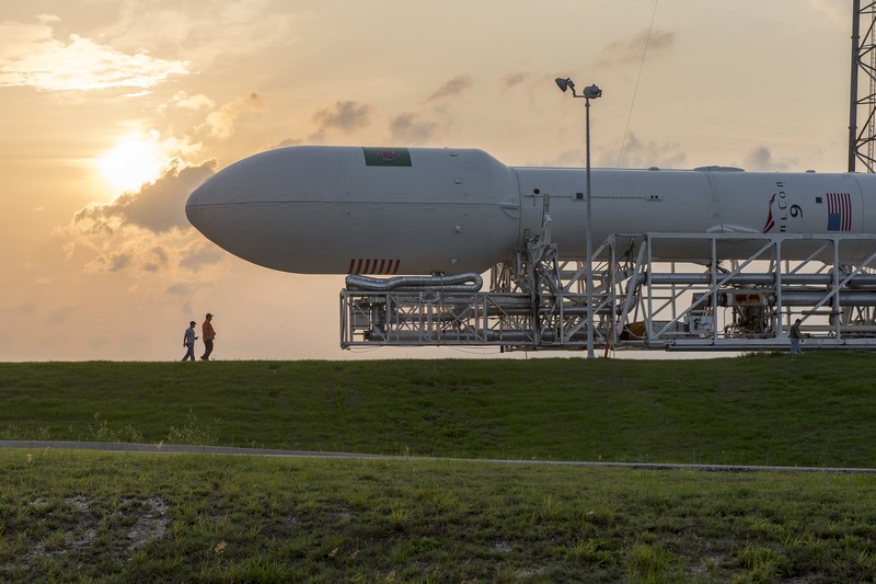 A SpaceX Falcon 9 rocket on a launch pad at Cape Canaveral during sunset