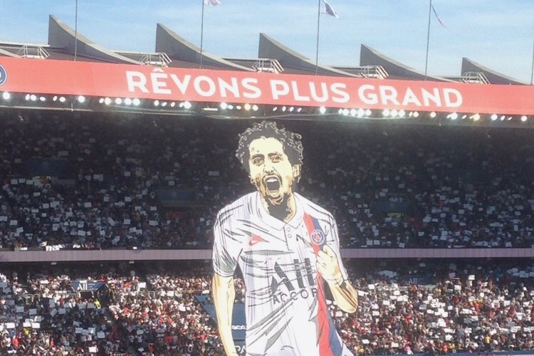 Tifo display at a packed Parc des Princes stadium during a PSG match