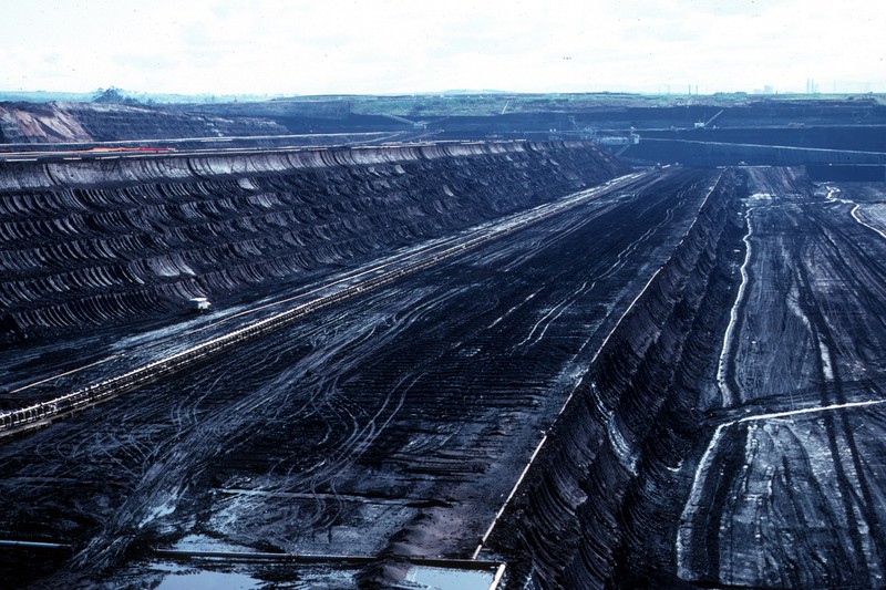Aerial view of Peak Downs and Saraji open-pit coal mines in Central Queensland, showing terraced excavation and layered geological strata