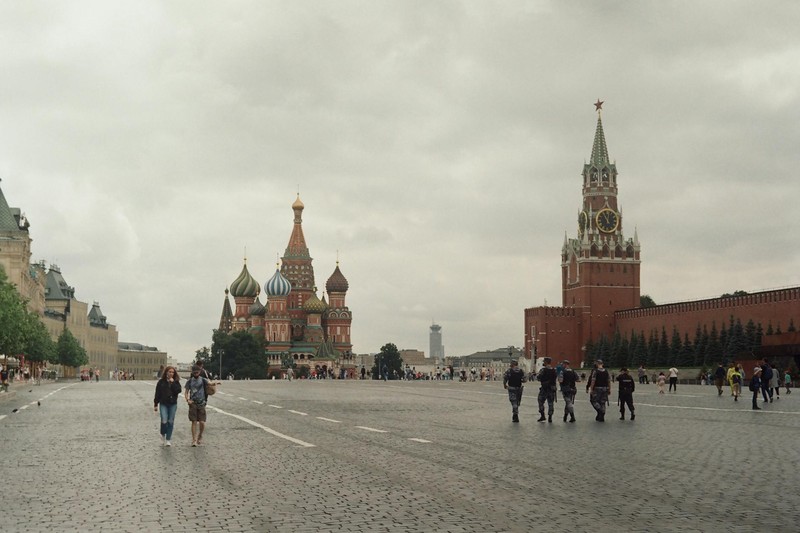 St. Basil's Cathedral and the Spasskaya Tower of the Kremlin seen across Red Square on an overcast day